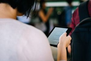 Woman reading a Kindle book